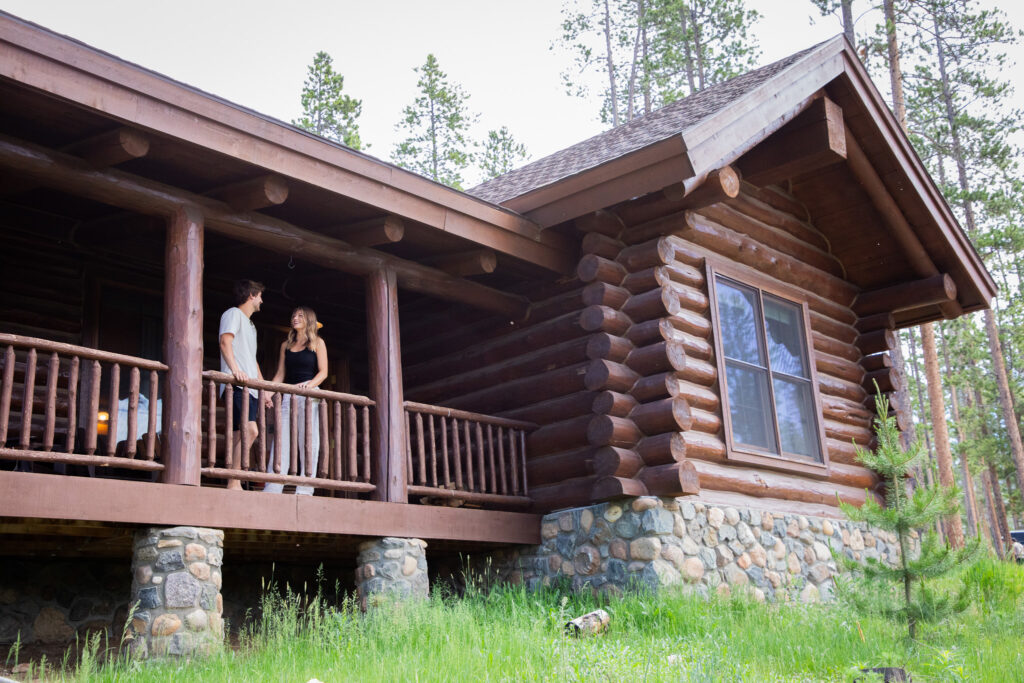 2-bed cabin with deck and couple relaxing
