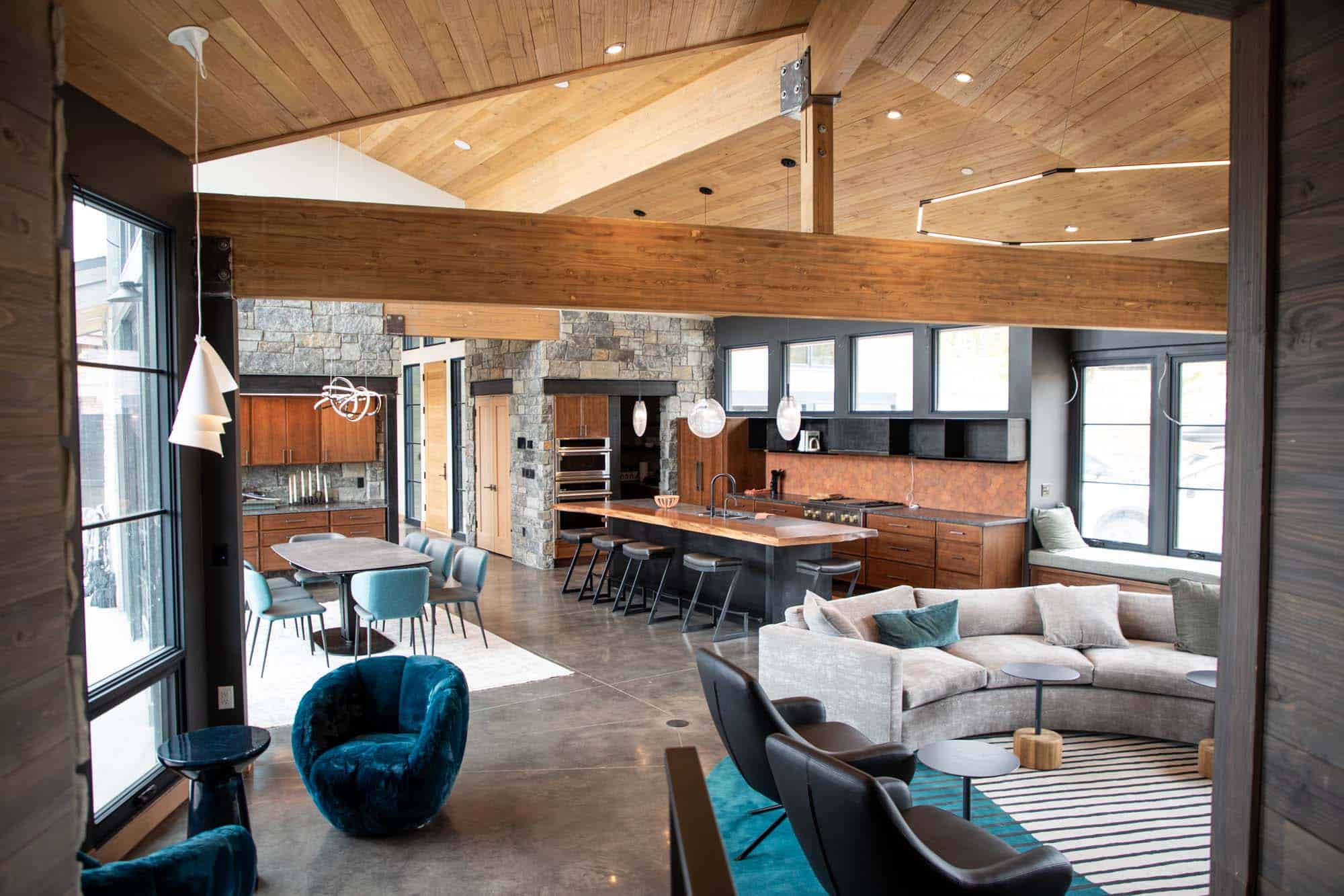 Modern mountain lodge interior with wood accents and comfortable seating.
