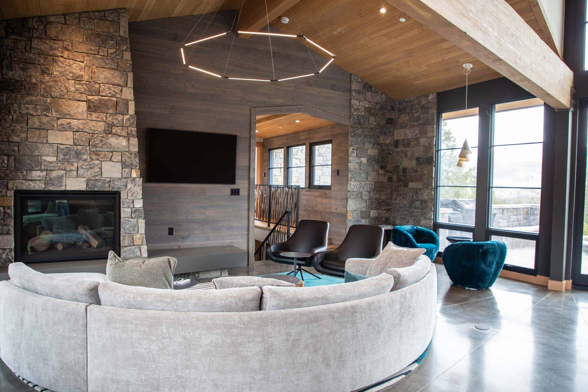 Cozy lounge area at Devil's Thumb Ranch with modern decor and large windows.