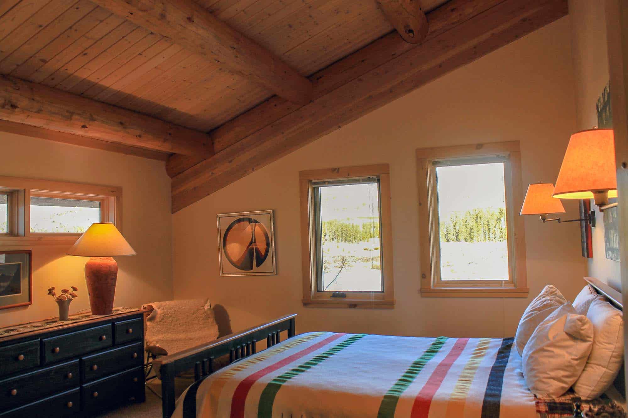 Bedroom at Devil's Thumb Ranch Resort & Spa with rustic decor and scenic views.