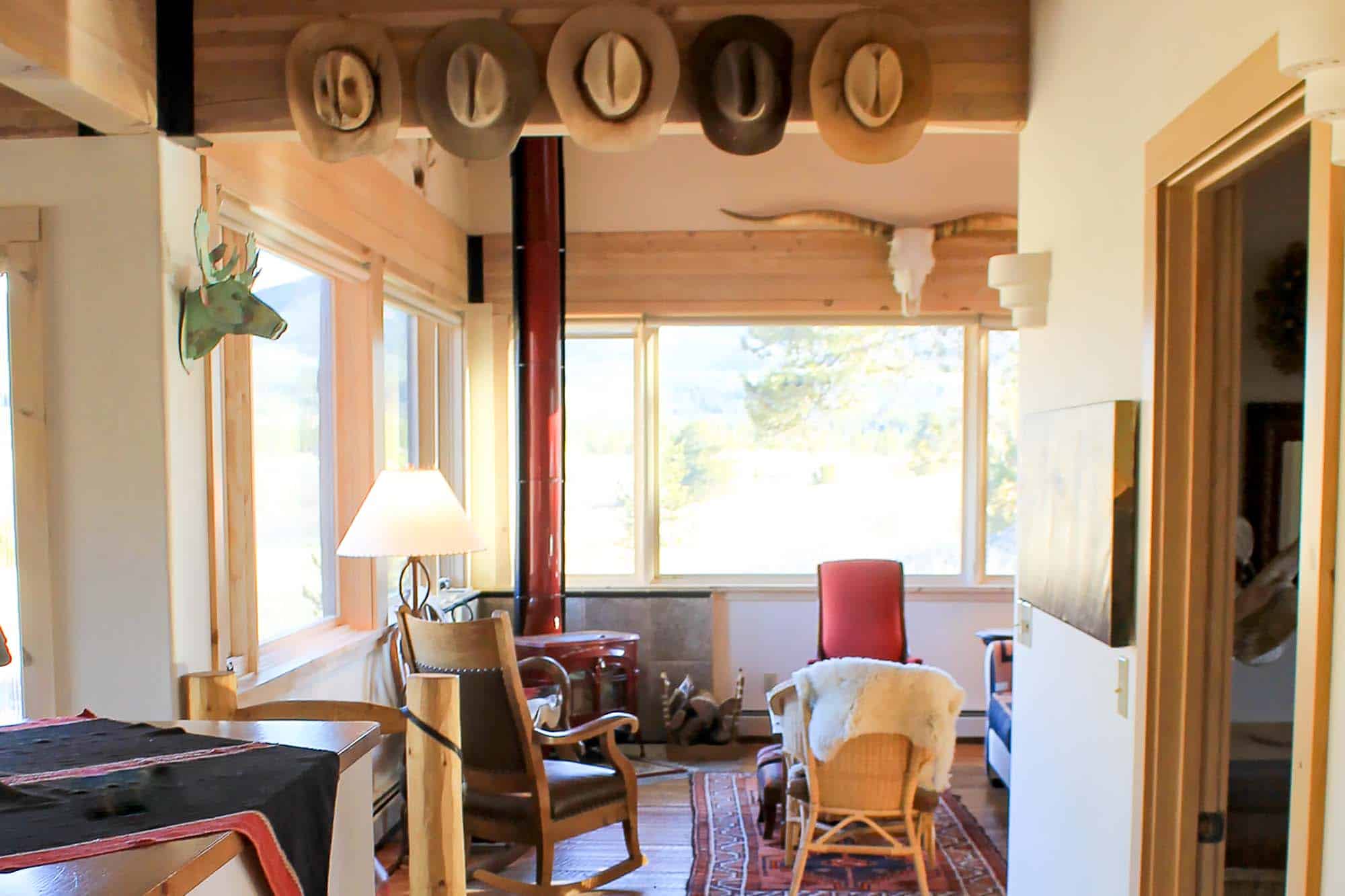 Warm and inviting mountain lodge interior with wooden accents and comfortable seating.