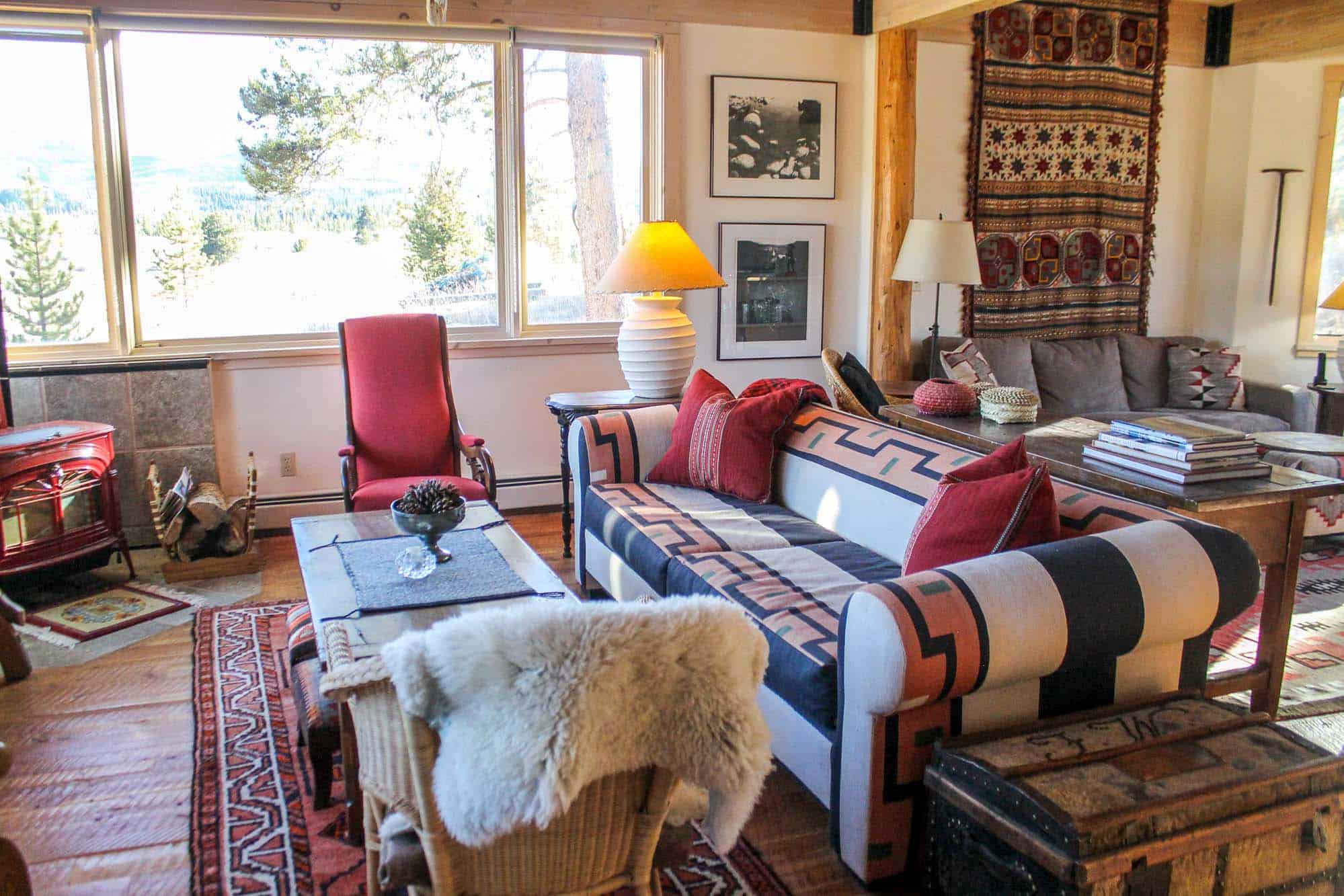 Cozy living room at Devil's Thumb Ranch Resort & Spa with colorful furniture and rustic decor.