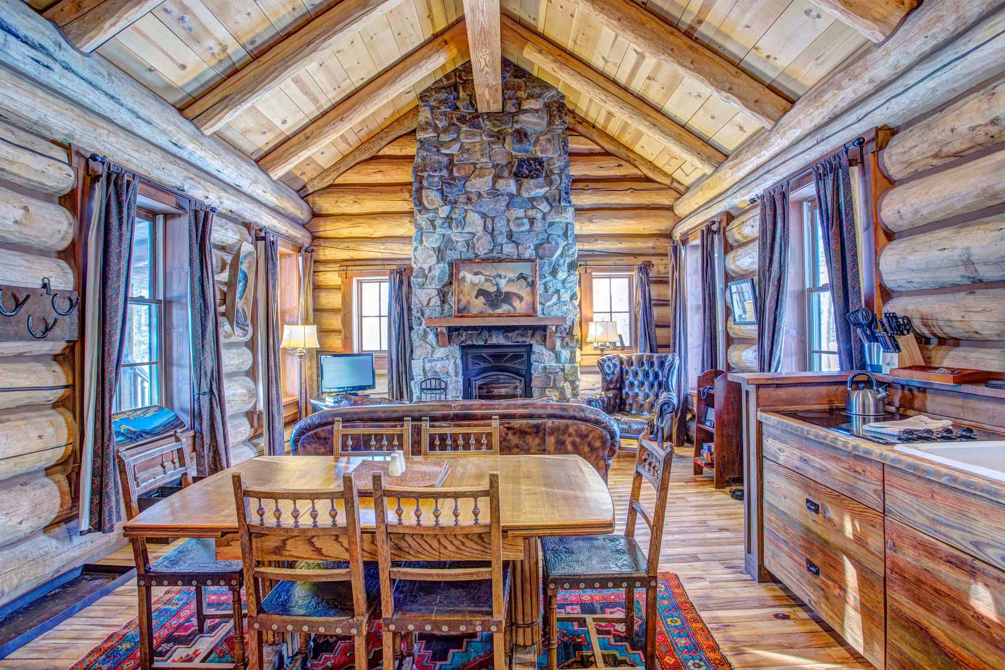 Interior of a cozy log cabin at Devil's Thumb Ranch Resort & Spa.
