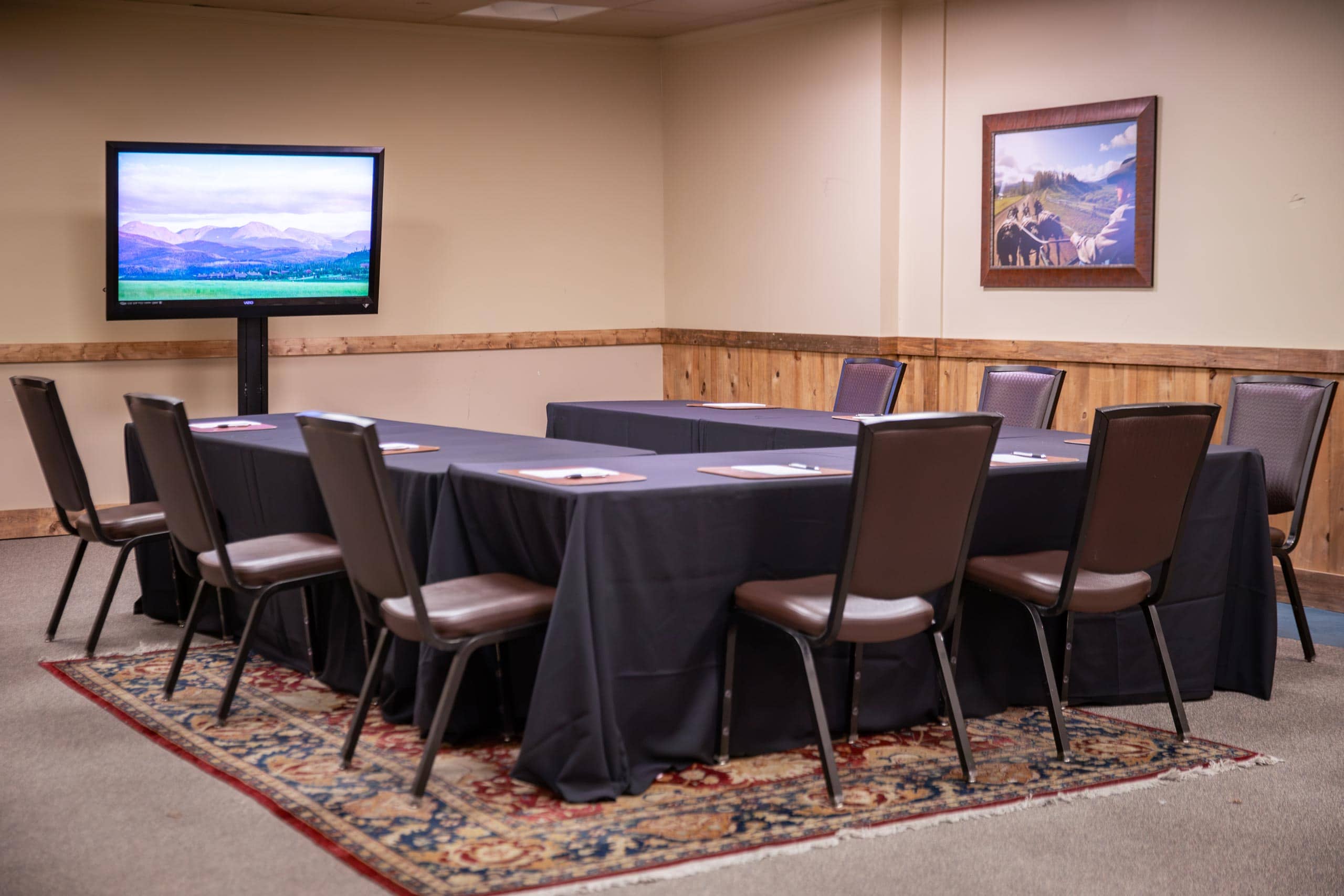 Conference room at Devil's Thumb Ranch Resort & Spa with TV and seating.