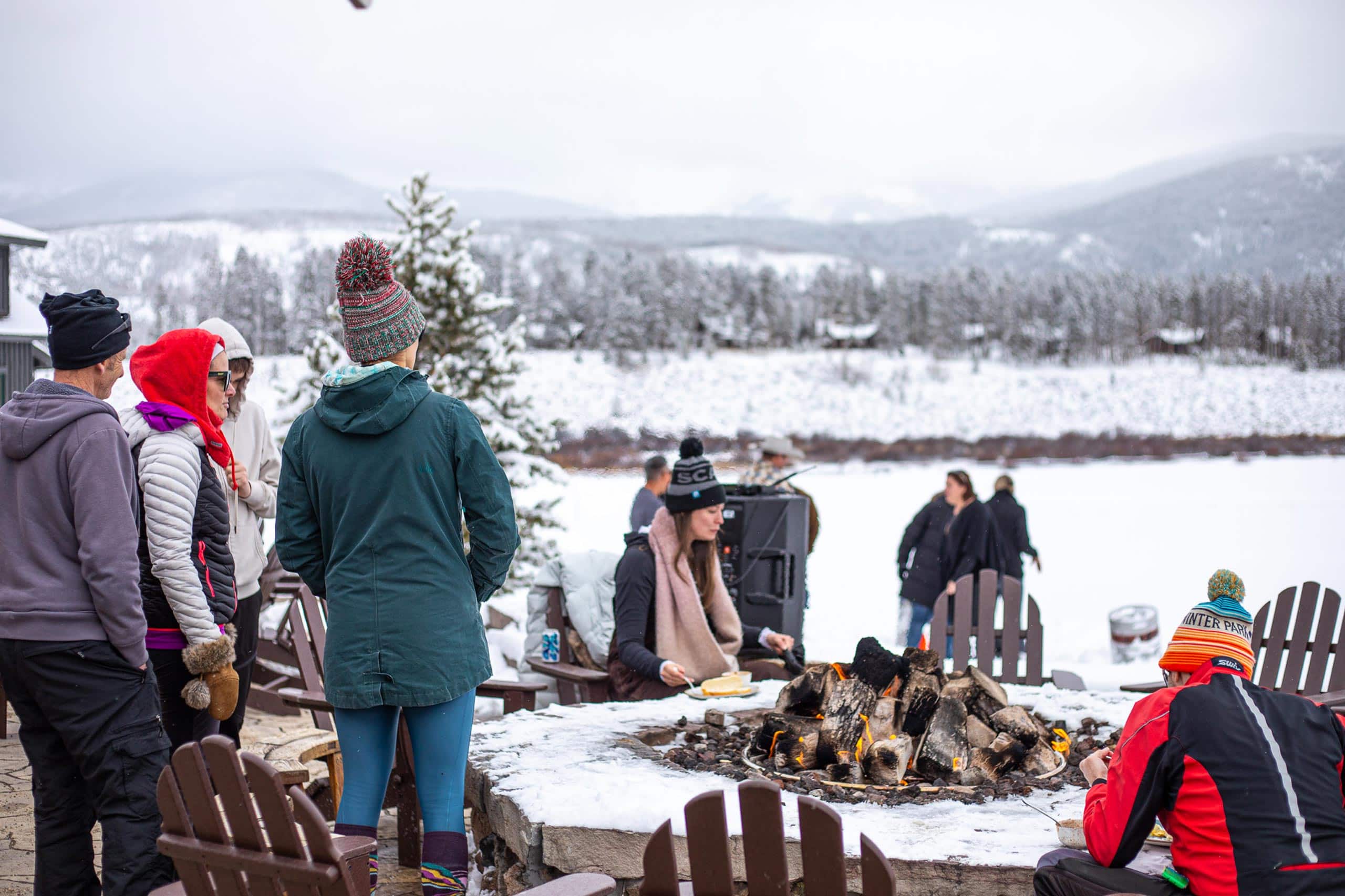 People enjoying a winter outdoor gathering at Devil's Thumb Ranch.