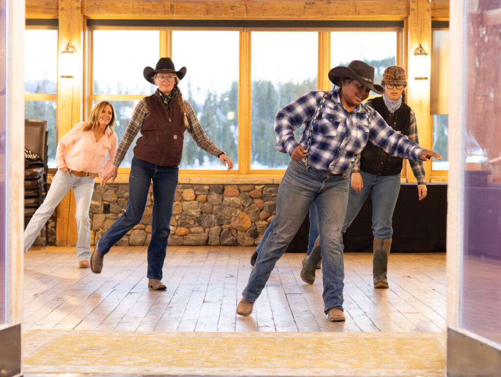 Group of people line dancing