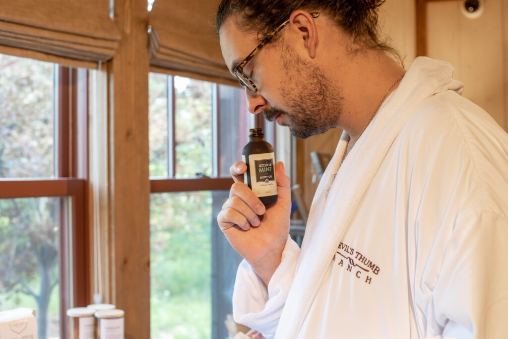 Person smells mint oil in Ranch Creek Spa